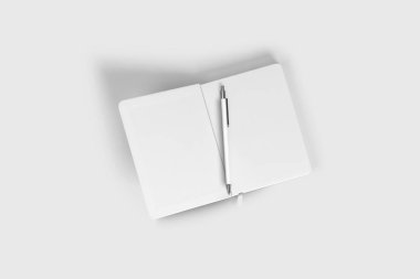 Beyaz arkaplanda izole edilmiş kalemle açık bir defter. 3 boyutlu görüntüleme. Model.