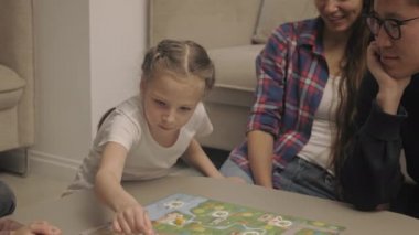 Family spends the evening playing board games