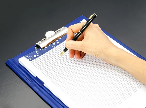 Woman's hand pen and notepad