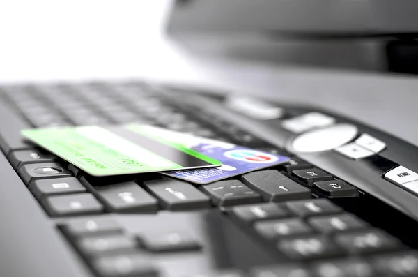 Credit cards on a keyboard — Stock Photo, Image