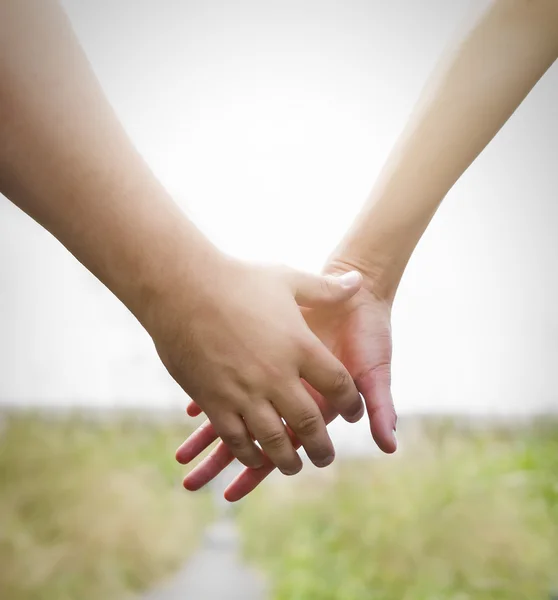 Couple holding hands — Stock Photo, Image