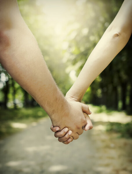 Couple holding hands