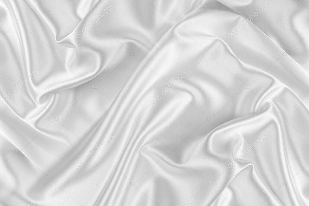 Closeup of rippled white silk fabric.
