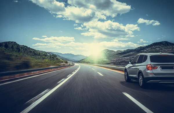 Car is driving along the road. White car on a suburban highway. — Stock Photo, Image