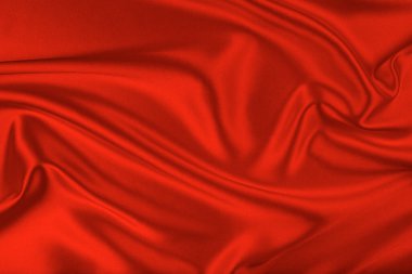 Dalgalı kırmızı ipek kumaş. Soyut bir arkaplan olarak beyaz ipek kumaş.
