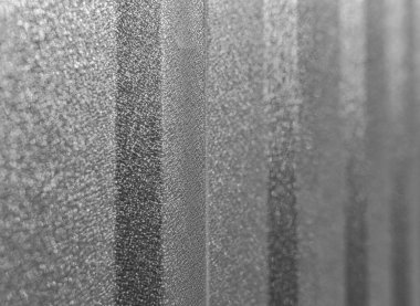 Profesyonel bir yaprağın dokusu veya soyut bir arkaplan olarak bükülmüş metal levha.