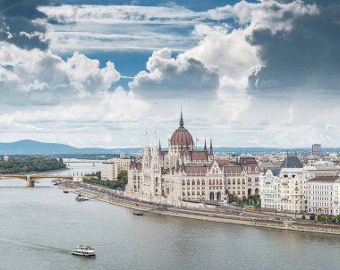 Budapest, Hungary - September 17, 2016: Building of the Hungarian Parliament city tram and cars in the city of Budapest.
