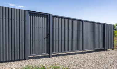 Iron gates from a profiled sheet on the site.