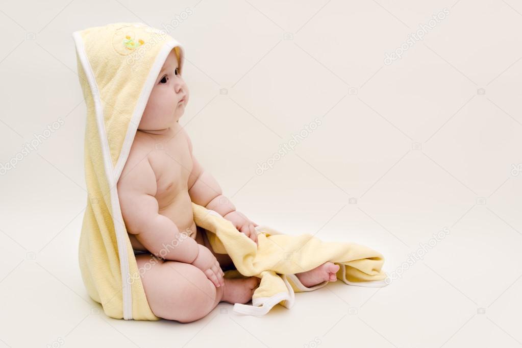 A baby in a towel