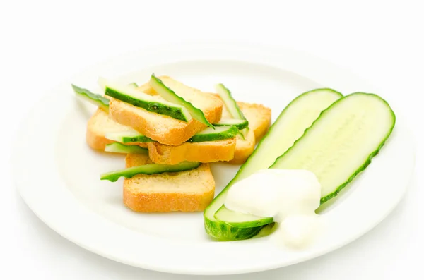 Diet appetizer of crispy toast and cucumber — Stock Photo, Image