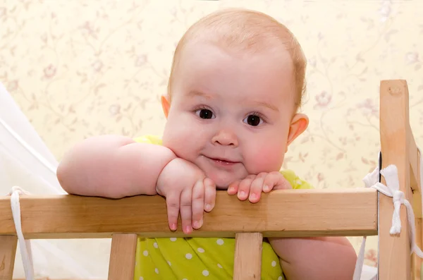 Baby in crib — Stock Photo, Image