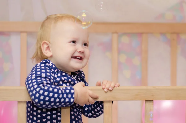 Baby girl and soap bubbles — Stock Photo, Image