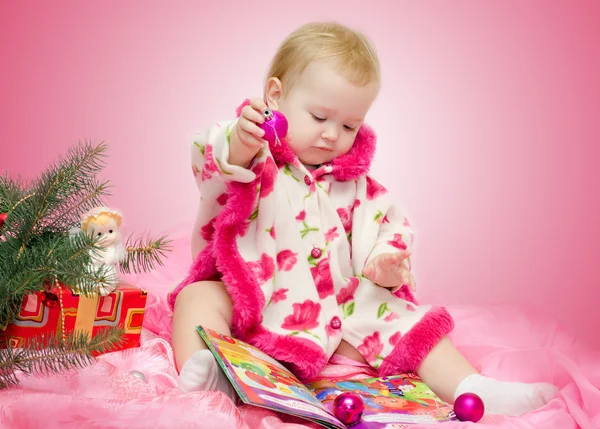 Baby with Christmas toys — Stok fotoğraf