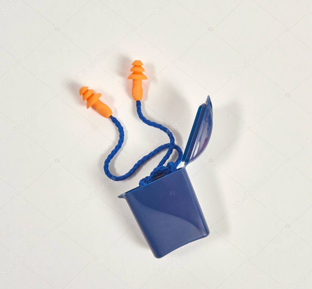 Earplug and box isolated on the white background, blue and orange product.