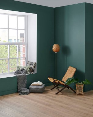 Modern köşe odası tarzı, yeşil duvar arka planı, sandalye konsepti, lamba battaniyesi ve yastık detayı..