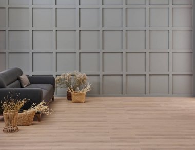 Gri oda dekoratif arka plan, koyu mavi kanepe, orta masa, battaniye yastık stili, pamuk çiçek ve halı vazosu, turuncu lamba, iç dekorasyon.