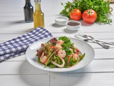 Green salad plate with shrimp for menu and vegetables background style.