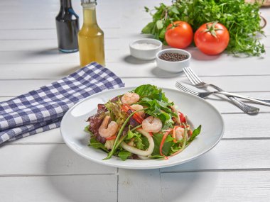 Green salad plate with shrimp for menu and vegetables background style.