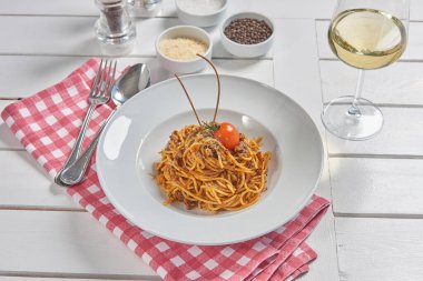Pasta and macaroni in the plate for menu style with sauce background.