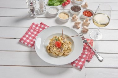 Pasta and macaroni in the plate for menu style with sauce background.