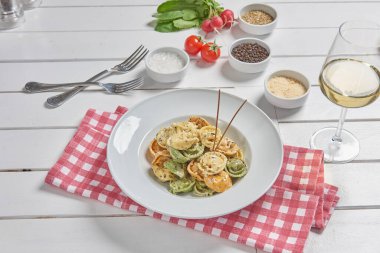 Pasta and macaroni in the plate for menu style with sauce background.