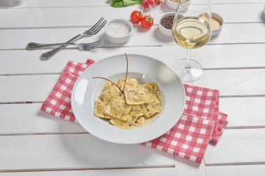 Pasta and macaroni in the plate for menu style with sauce background.