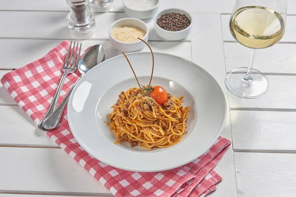 Pasta and macaroni in the plate for menu style with sauce background.