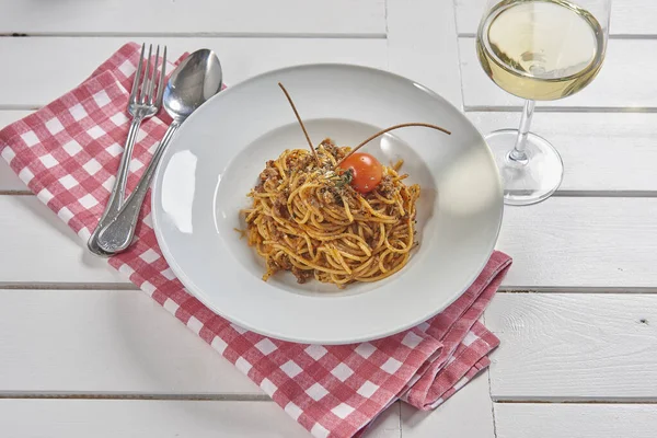 Pasta and macaroni in the plate for menu style with sauce background.