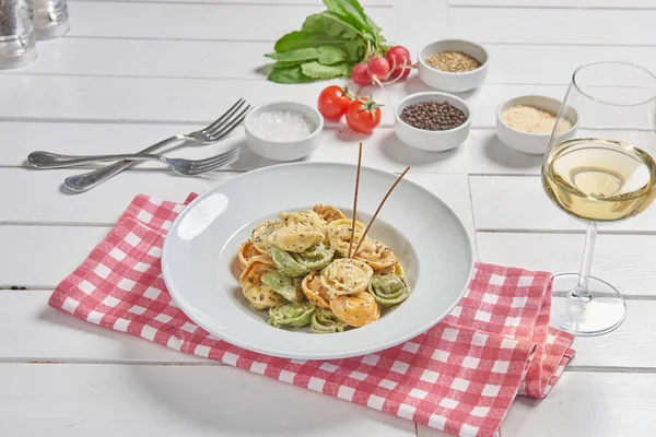 Pasta and macaroni in the plate for menu style with sauce background.