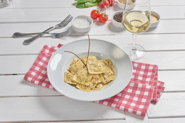 Pasta and macaroni in the plate for menu style with sauce background.