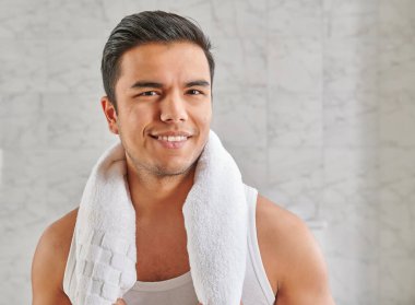 Man who wants to shave in front of the mirror, athlete and towel style, beard in the bathroom. Uzbekistan people.