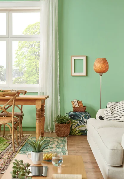 Green living room and wall background concept, wooden furniture, table, chair vase of plant and brown parquet style.