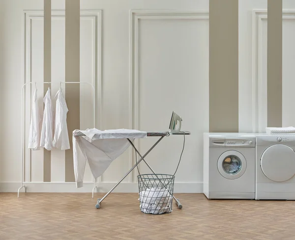 Washing dryer machine and ironing table interior style, laundry room, white and brown vertical wall background.