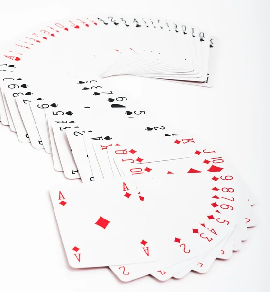 Playing cards. All the cards form an "S" on a white background. — Stock Photo, Image