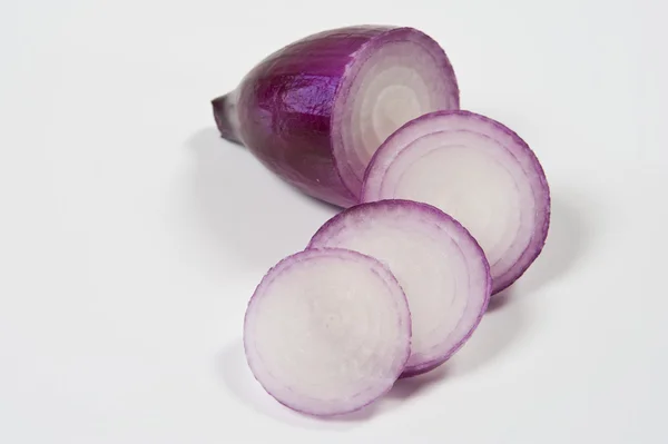 Red Tropea onion and sliced on a white background — Stock Photo, Image