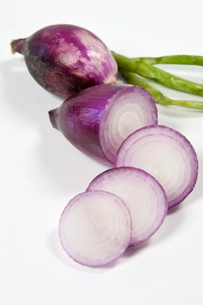 Red Tropea onion and sliced on a white background — Stock Photo, Image