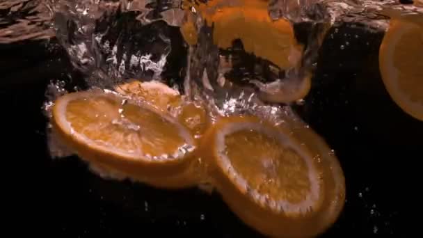 Orange Flies Water Slow Motion — Stock Video