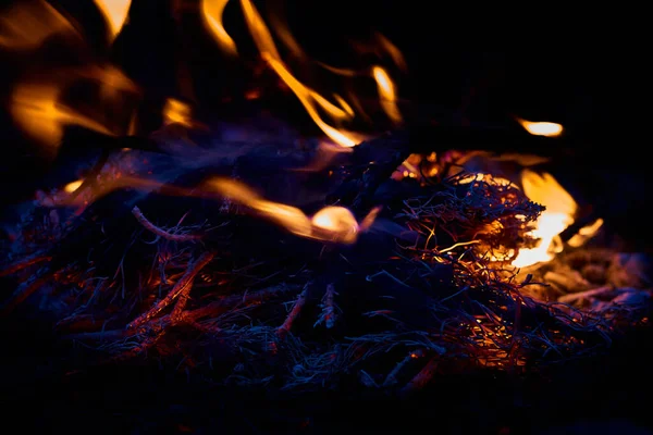 a large open-air fire used as part of a celebration, for burning trash, or as a signal.