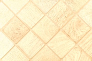 a thin rectangular slab of baked clay, concrete, or other material, used in overlapping rows for covering roofs.Blurred pale wooden checkered background tiles for text inscriptions signs. 