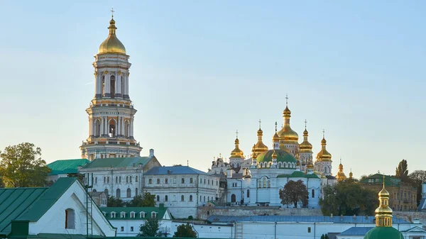 a building used for public Christian worship. Orthodox church with golden domes and blue sky. Monastery Kyiv Lavra