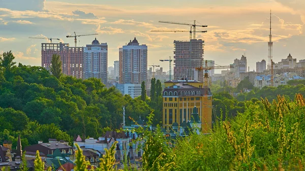 a structure with a roof and walls, such as a house, school, store, or factoryNew building and construction in a great location Podol in Kyiv Ukraine.