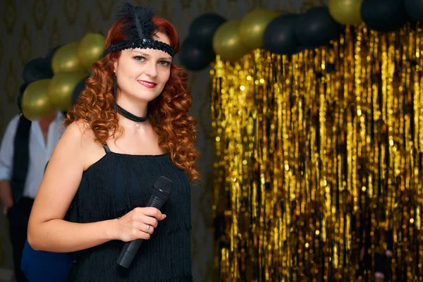 a person who writes for newspapers, magazines, or news websites or prepares news to be broadcast. Charming event host woman, wedding presenter in black vintage style on a gold