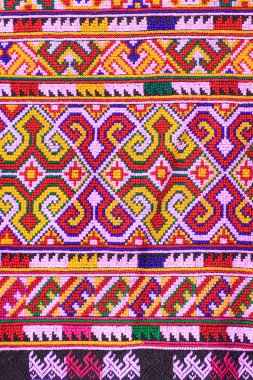 Tayland 'ın kuzeyinde geleneksel dokuma kumaş desenleri. Eski kumaş renginde Tayland el işi..