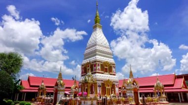 Time lapse, clouds puffy are moving above the Renu Pagoda of Phra That Renu temple in Nakhon Phanom, Thailand. The scenery of clouds in motion over the Renu Pagoda