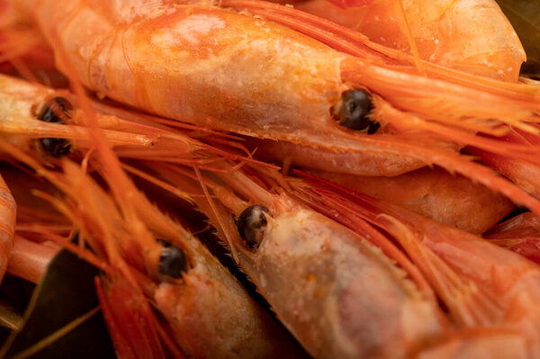 Atlantic shrimp cooked with allspice and bay leaf close-up, surface texture