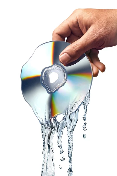 Man hand holding a compact disc whis is melting and morphing into water ripples — Stock Photo, Image