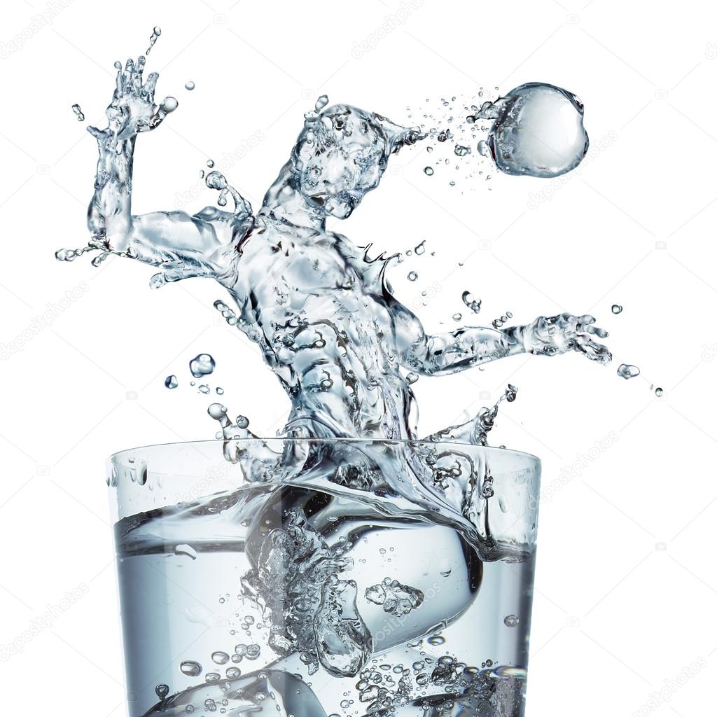 Glass of water with a splash shaped as a soccer player jumping a