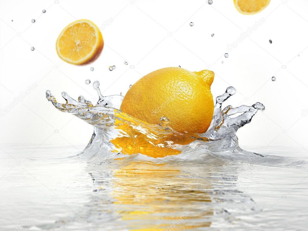 lemon splashing into clear water
