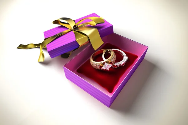 Opened gift box with golden ribbon — Stock Photo, Image