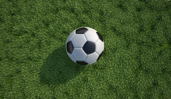Ποδόσφαιρο, μπάλα ποδοσφαίρου από κοντά στο γρασίδι. κάτοψη. — Φωτογραφία Αρχείου